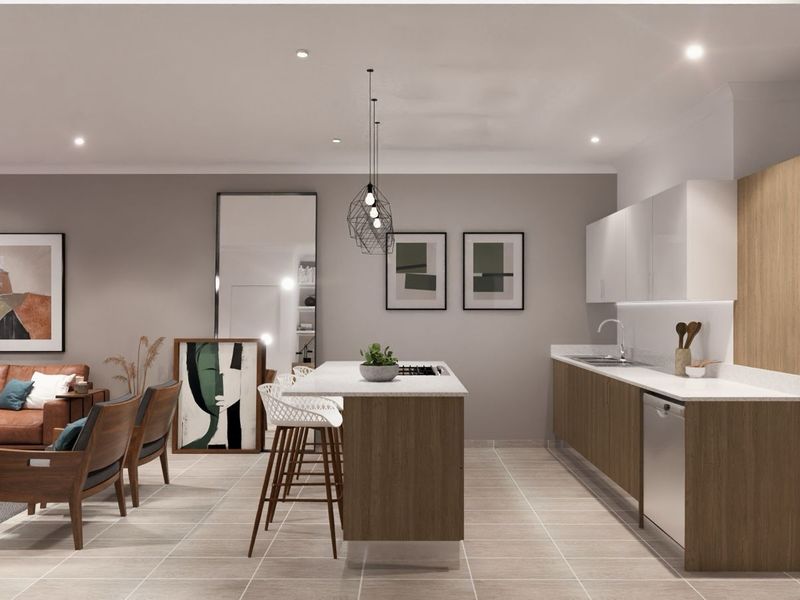 Modern open-plan living area featuring a sleek kitchen with wood-grain cabinetry, stone countertops, integrated appliances, and recessed lighting throughout the space.