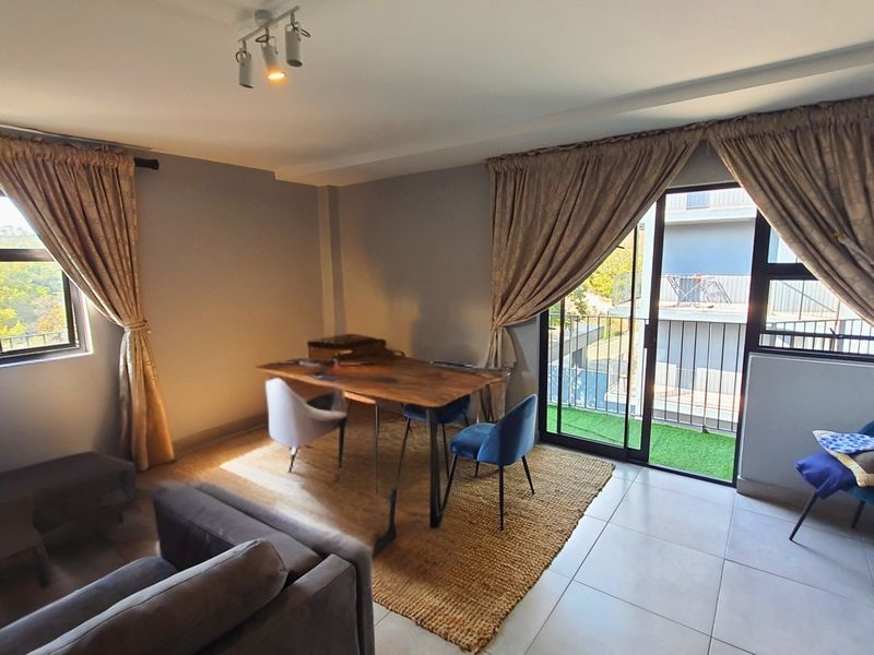 Modern Apartment with Patio in Sought After Complex - Photo 2