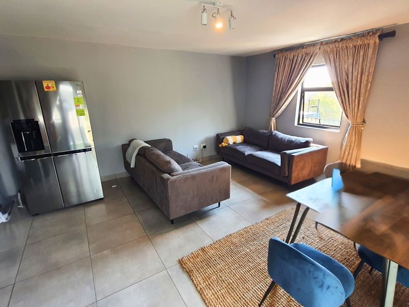 Modern Apartment with Patio in Sought After Complex - Photo 3