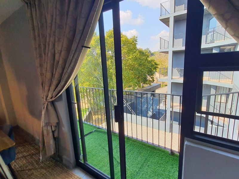 Modern Apartment with Patio in Sought After Complex - Photo 10