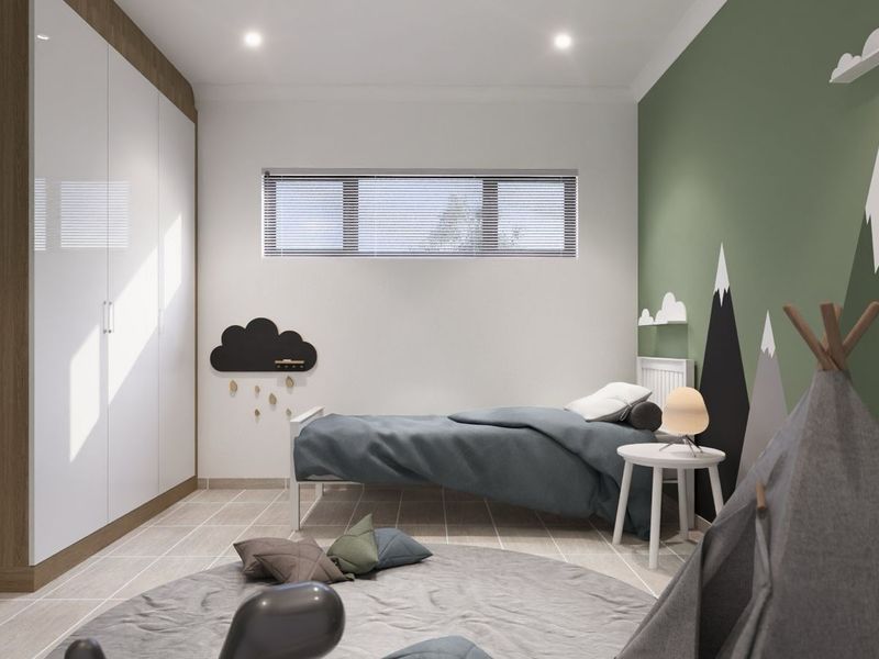A modern bedroom featuring built-in floor-to-ceiling wardrobes, tiled flooring, and a feature wall with mountain-themed decor.