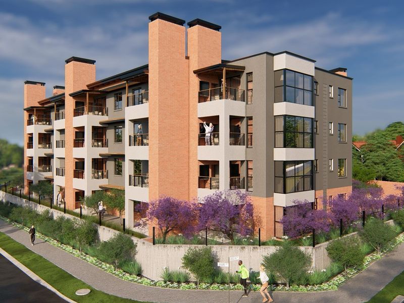A modern multi-story apartment building featuring brick and rendered facades, private balconies, and landscaped perimeter gardens in a contemporary residential setting.