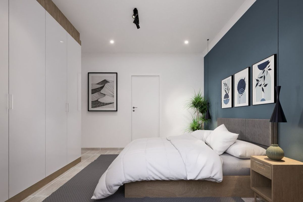 A modern bedroom featuring built-in floor-to-ceiling wardrobes, a feature wall, and recessed downlighting.