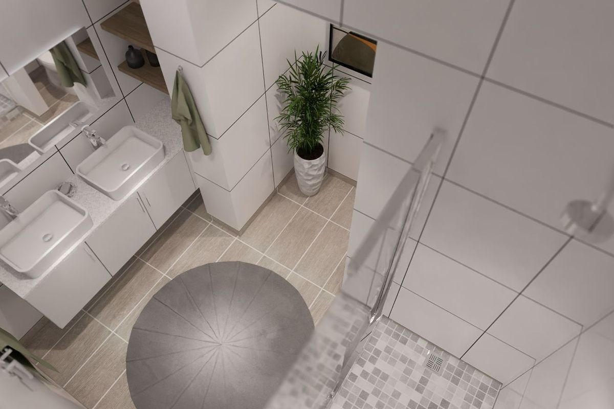 Modern bathroom featuring a double vanity with integrated sinks, a walk-in shower with glass screen, and contemporary tiled finishes.