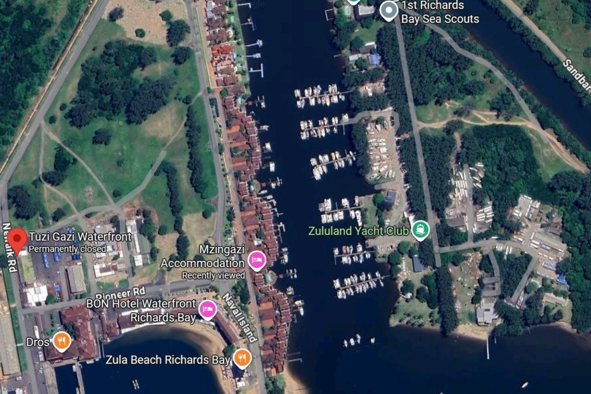 Aerial view of the waterfront area in Richards Bay, showing the marina, yacht club, and surrounding estate infrastructure.