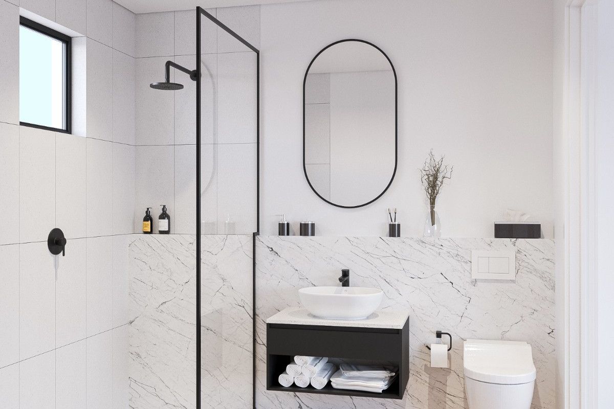 Modern bathroom featuring a walk-in shower with black frame, wall-mounted vanity, vessel sink, and marble-look tiling.