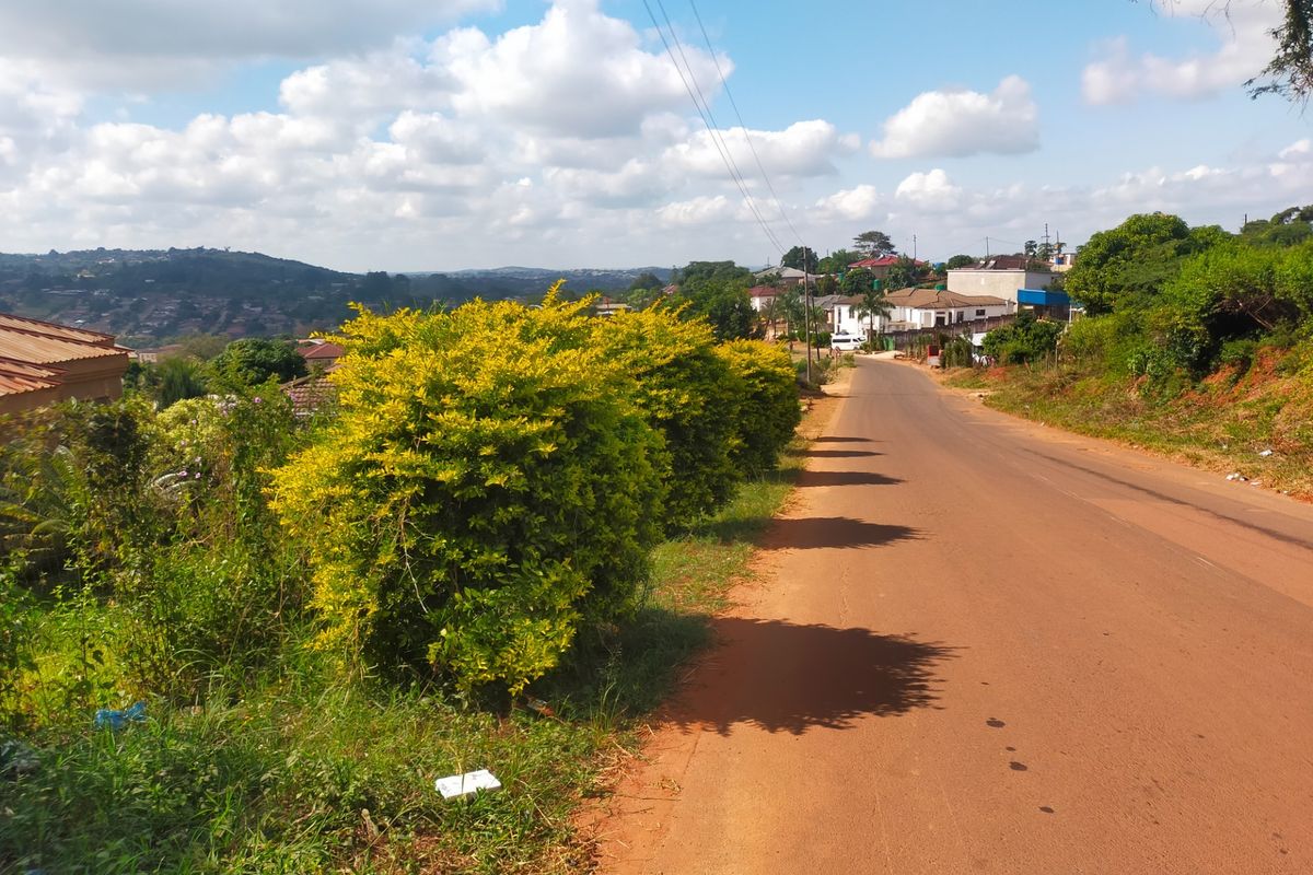 A view of the local street and surrounding neighbourhood landscape, showing the road approach and nearby residential properties.