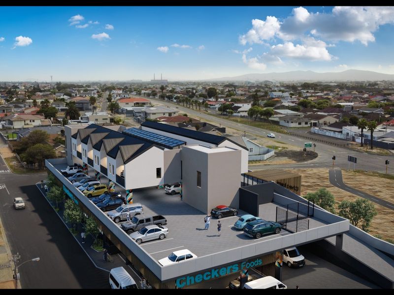 An aerial view of a modern apartment complex featuring a rooftop parking area and ground-level commercial space.