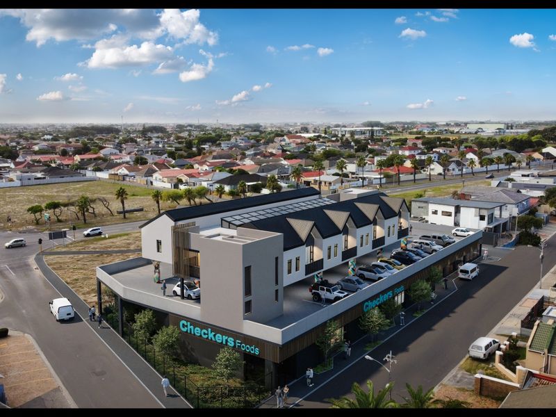 Aerial view of a modern mixed-use development featuring a ground-floor retail space with residential units above and dedicated parking.