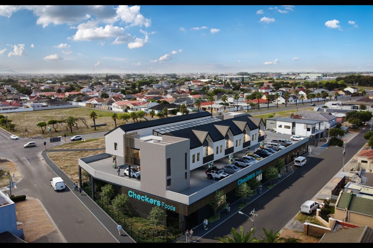 Aerial view of a modern mixed-use development featuring a ground-floor retail space with residential units above and dedicated parking.