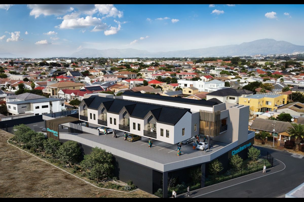 An aerial perspective of a modern apartment complex featuring contemporary architectural design, integrated parking facilities, and a prominent commercial ground-floor presence.