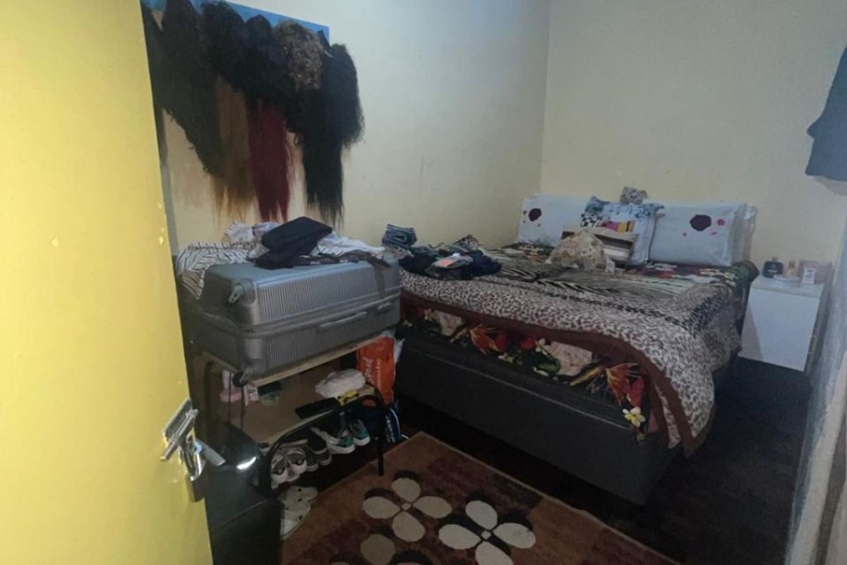 A compact bedroom featuring a ceiling fan and standard interior finishes, suitable for a single occupant or guest room.