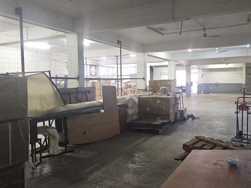 Spacious industrial warehouse area featuring high ceilings, concrete flooring, and open-plan layout suitable for storage or manufacturing operations.