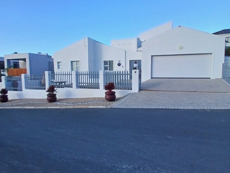 Elegant Coastal Residence with Exceptional Entertainment Spaces and Income Potential - Photo 1