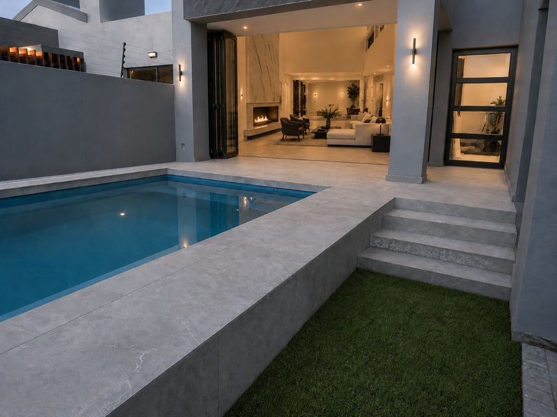An elegant Sandown home anchored by a warm statement fireplace. - Photo 8
