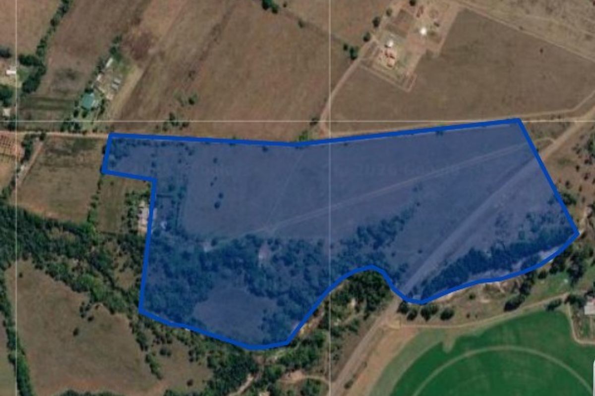 An aerial view of the farm property showing the land boundaries, wooded sections, and open grazing areas.