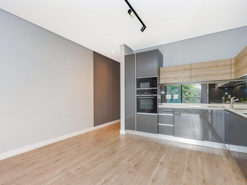 High-Design Luxury Meets Elite Urban Living: Impeccable 2-Bed, 2-Bath Haven at Tree Tops - Photo 6