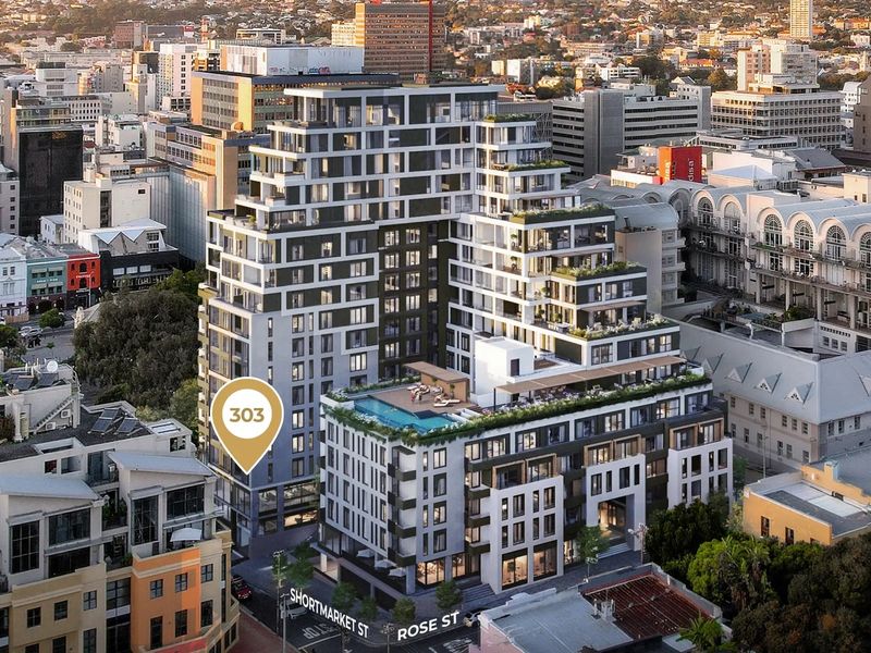 Aerial view of a modern apartment building complex featuring a rooftop pool, landscaped terraces, and a central urban location.