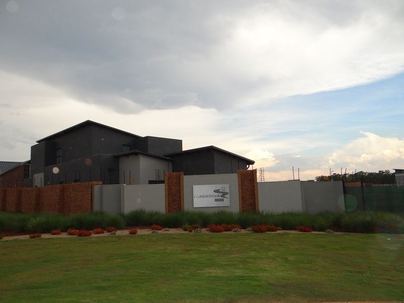 View of the Fountainbrook Estate entrance featuring a modern boundary wall with brick accents and integrated signage.