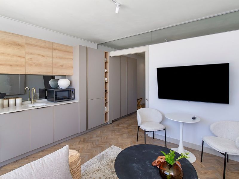 Experience luxury urban living in this beautifully appointed Ground floor fully furnished 1-bedroom - Photo 4