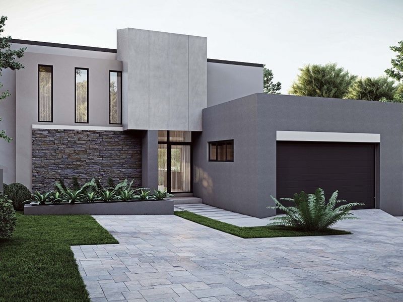 Modern architectural front elevation featuring stone cladding, clean grey render, integrated garage, and paved driveway with landscaped garden beds.