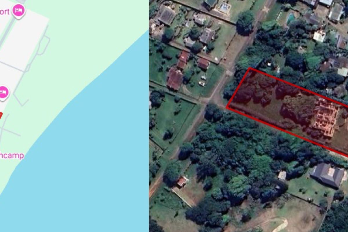 Aerial view of the commercial property site, highlighting the land boundaries and existing building footprint within the surrounding neighborhood context.