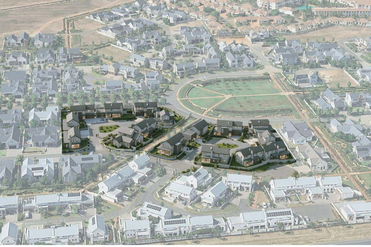 An aerial view of a modern residential housing development within a larger estate, showcasing the layout, road network, and surrounding neighborhood context.
