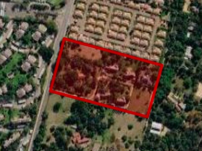 Aerial view of the property highlighting the land boundaries and surrounding residential area.