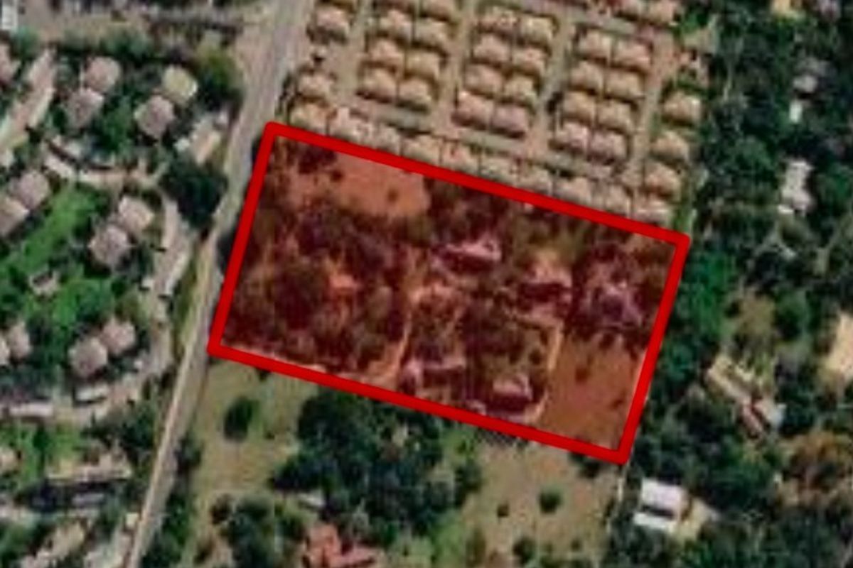 Aerial view of the property highlighting the land boundaries and surrounding residential area.