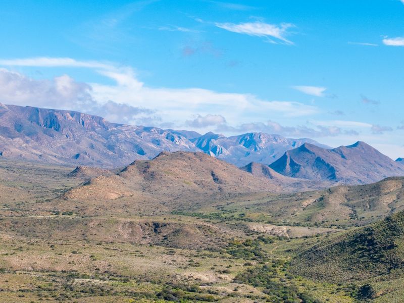 A scenic, expansive view of the surrounding mountainous landscape and natural terrain, showcasing the property's rural setting.