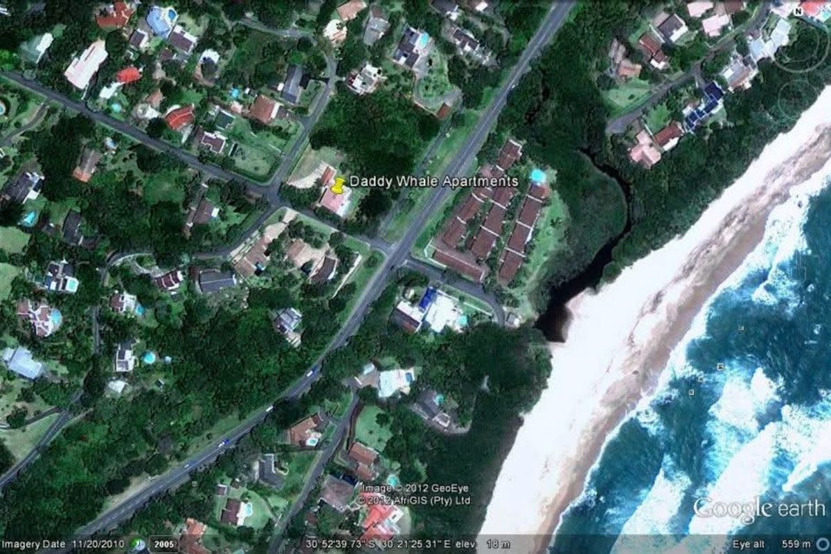 An aerial satellite view showing the property location in relation to the coastline and surrounding residential neighborhood.