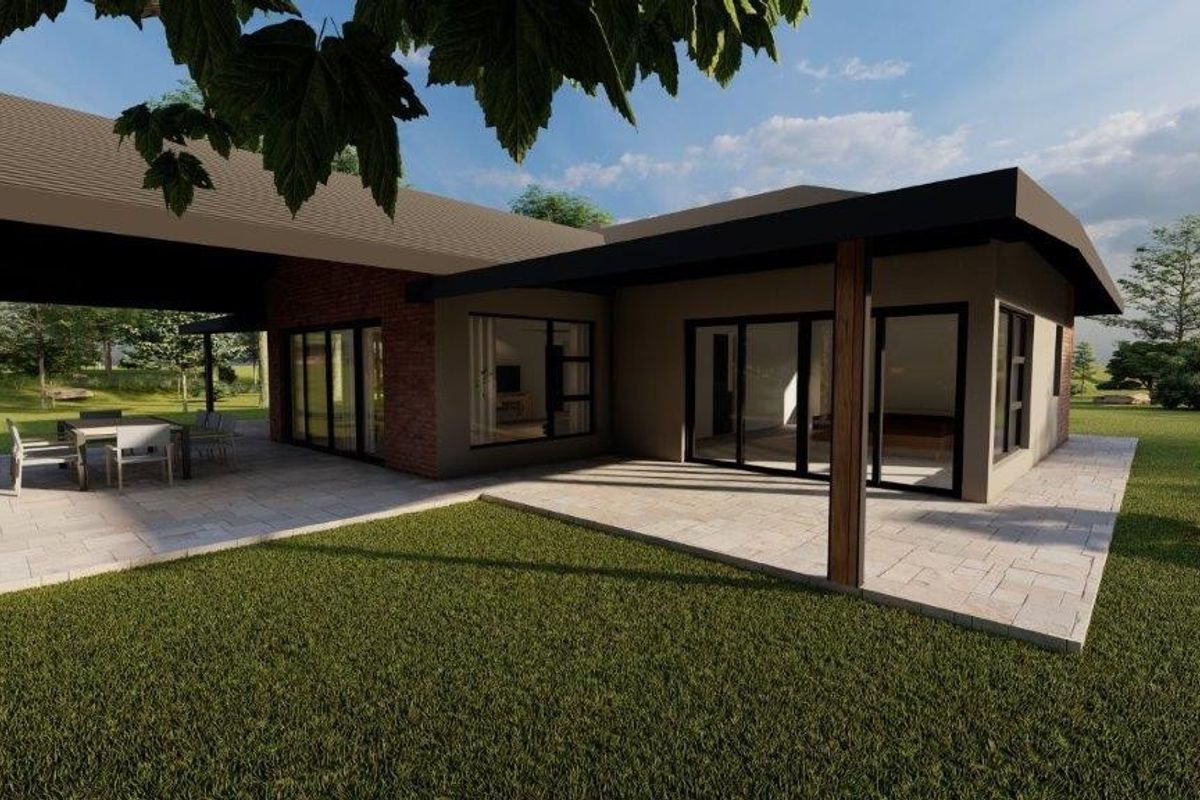 A modern residential exterior featuring a spacious covered patio, paved terrace, and large sliding glass doors opening to a landscaped garden.