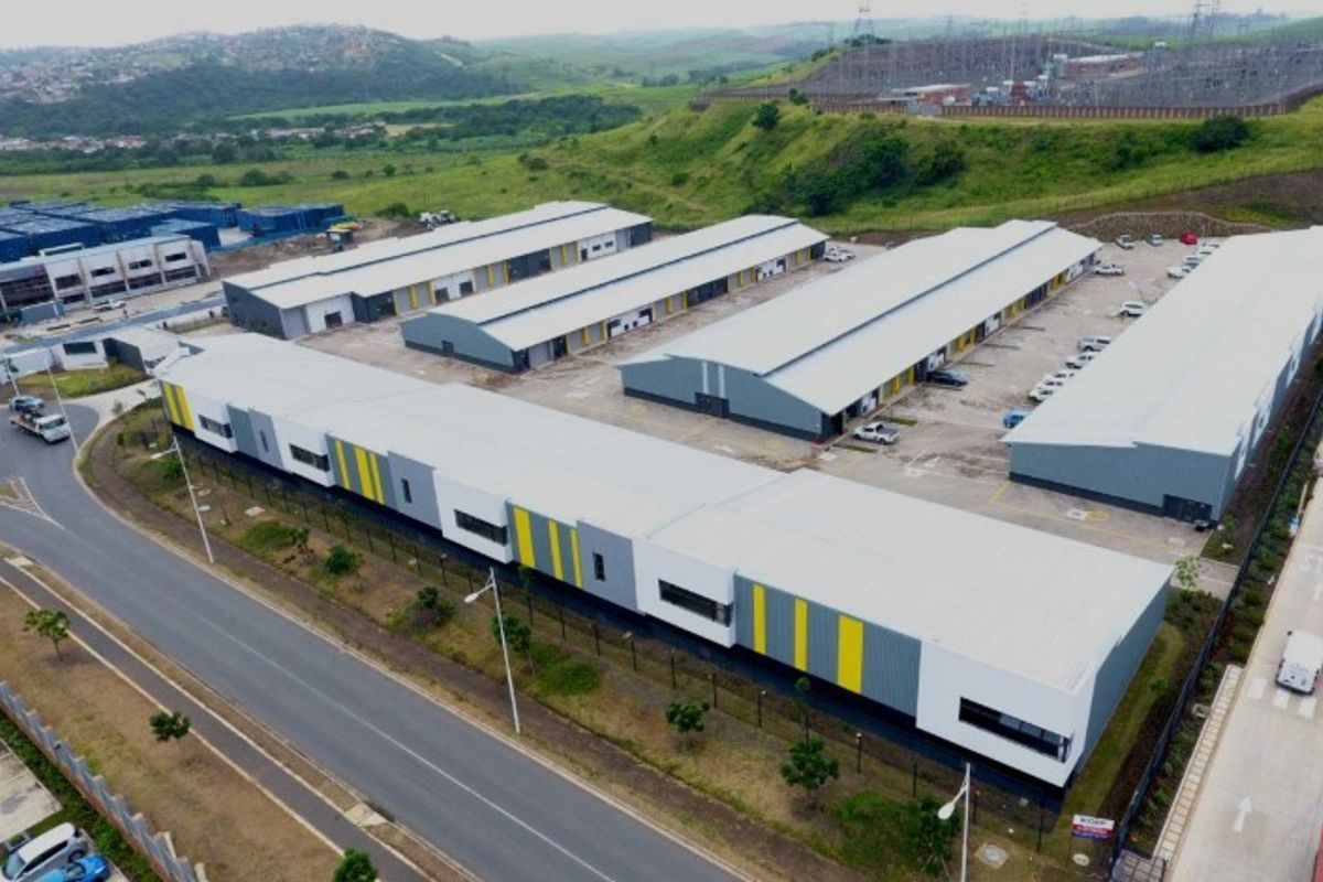 Aerial view of a modern industrial warehouse park featuring multiple units, paved loading areas, and secure perimeter access.