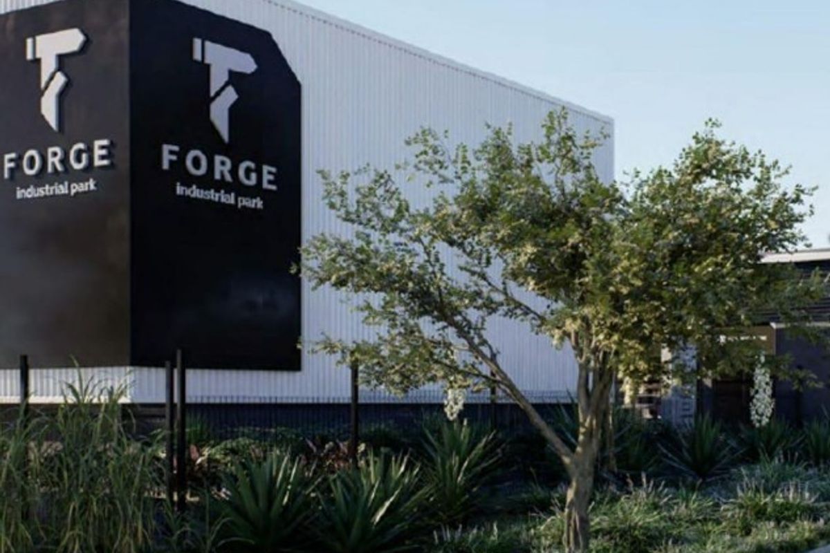 Front elevation of Forge Industrial Park featuring modern corrugated metal cladding, prominent branding, and well-maintained landscaped grounds.