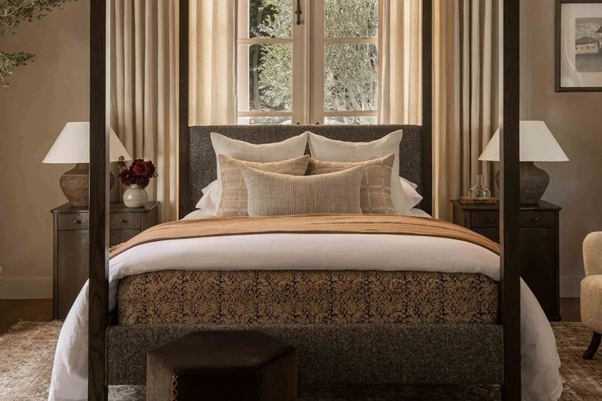A well-appointed bedroom featuring elegant french doors that provide natural light and a view of the surrounding greenery.