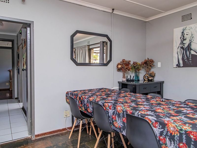 A dining room featuring tiled flooring and neutral wall finishes, providing a functional space for family meals and entertaining.