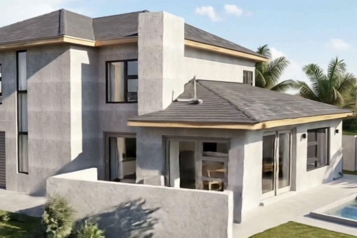Rear view of a modern two-story house featuring a swimming pool, concrete exterior finish, and large sliding glass doors leading to the patio.