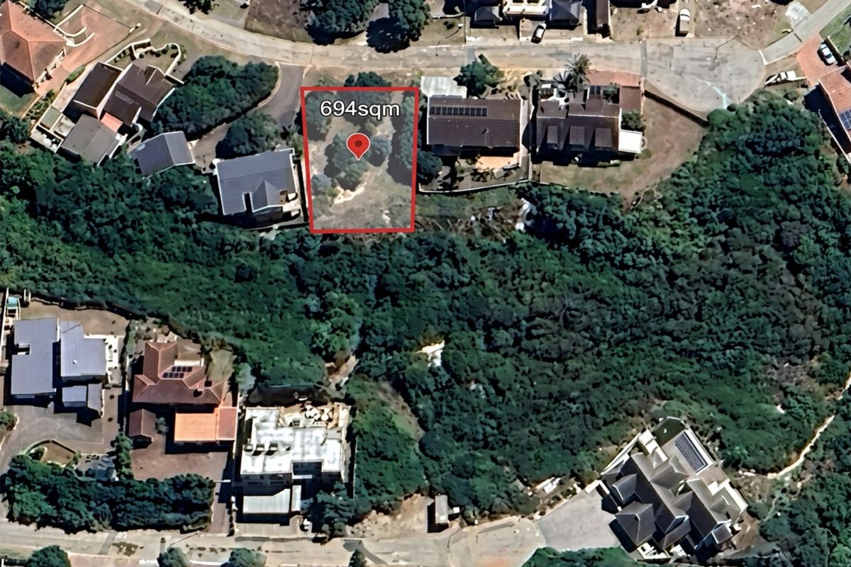 An aerial view of a 694sqm vacant residential plot situated within an established neighborhood.