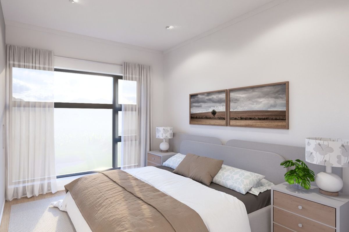 A bright and modern bedroom featuring large windows with natural light, recessed downlights, and neutral finishes, creating a comfortable and inviting living space.