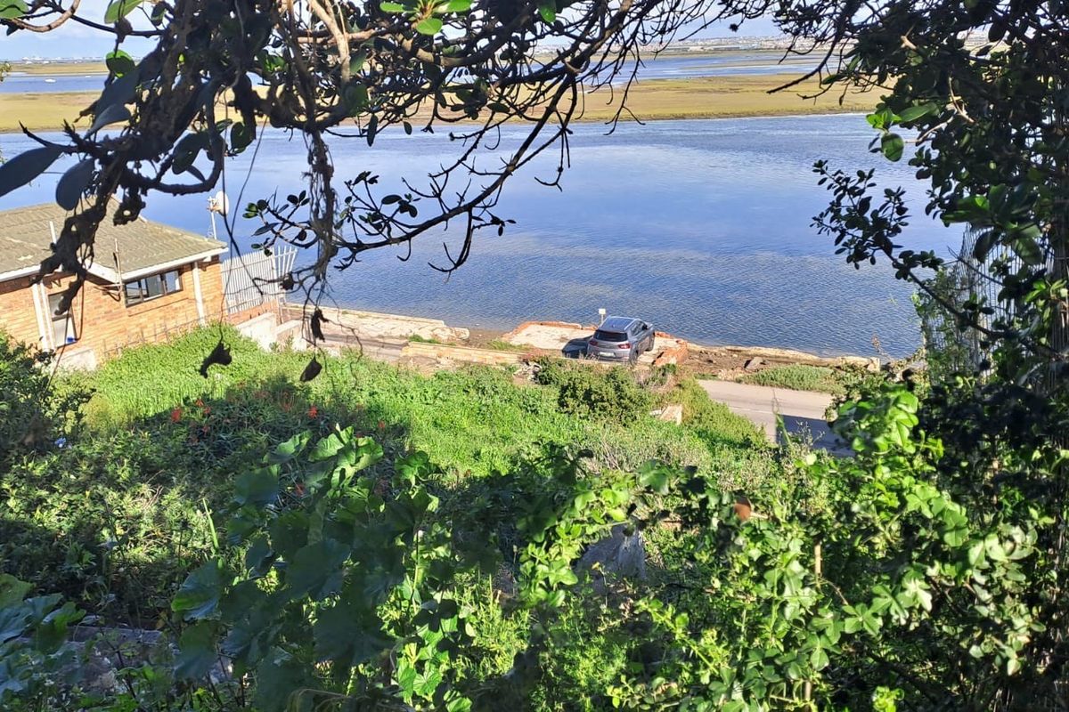 A scenic elevated view overlooking the waterfront, showcasing the natural landscape and proximity to the water's edge.