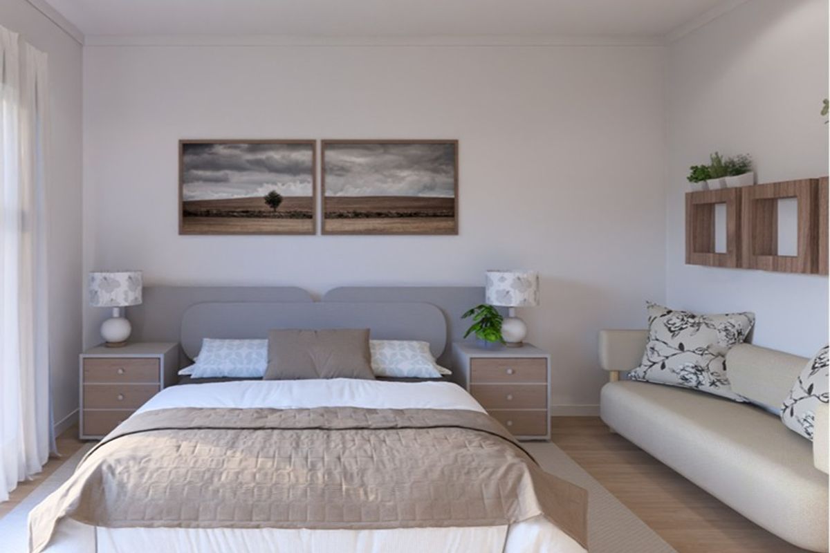 A well-lit, modern bedroom featuring neutral tones, timber flooring, and recessed downlighting, creating a comfortable and inviting living space.