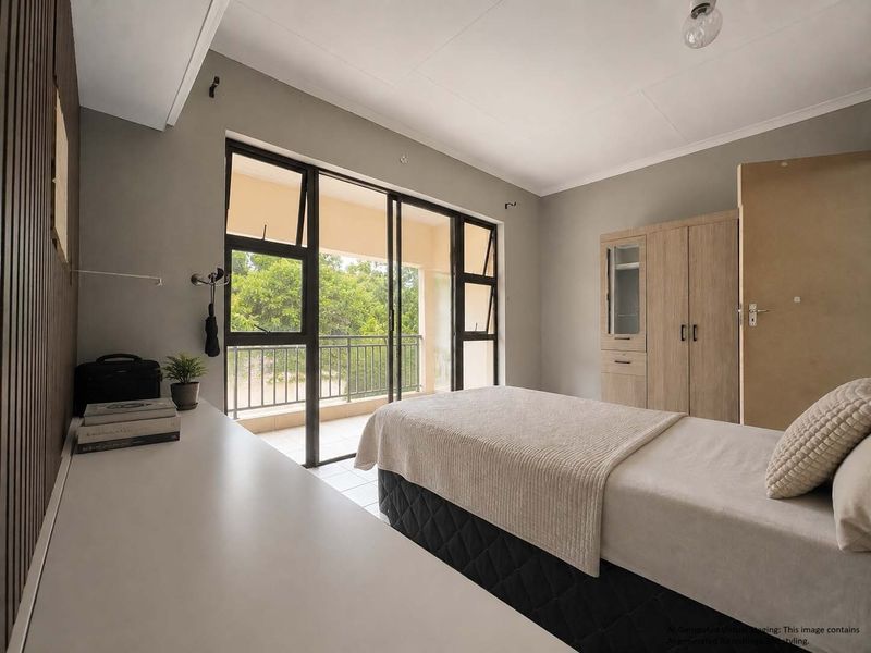A well-lit bedroom featuring built-in cabinetry, modern slatted wall detailing, and direct access to a private balcony through large sliding glass doors.