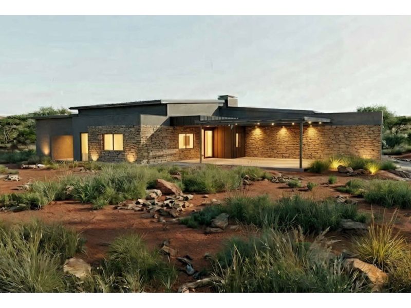 A modern architectural rendering of a residential property featuring stone cladding, a covered patio, and integrated lighting set in a natural landscape.