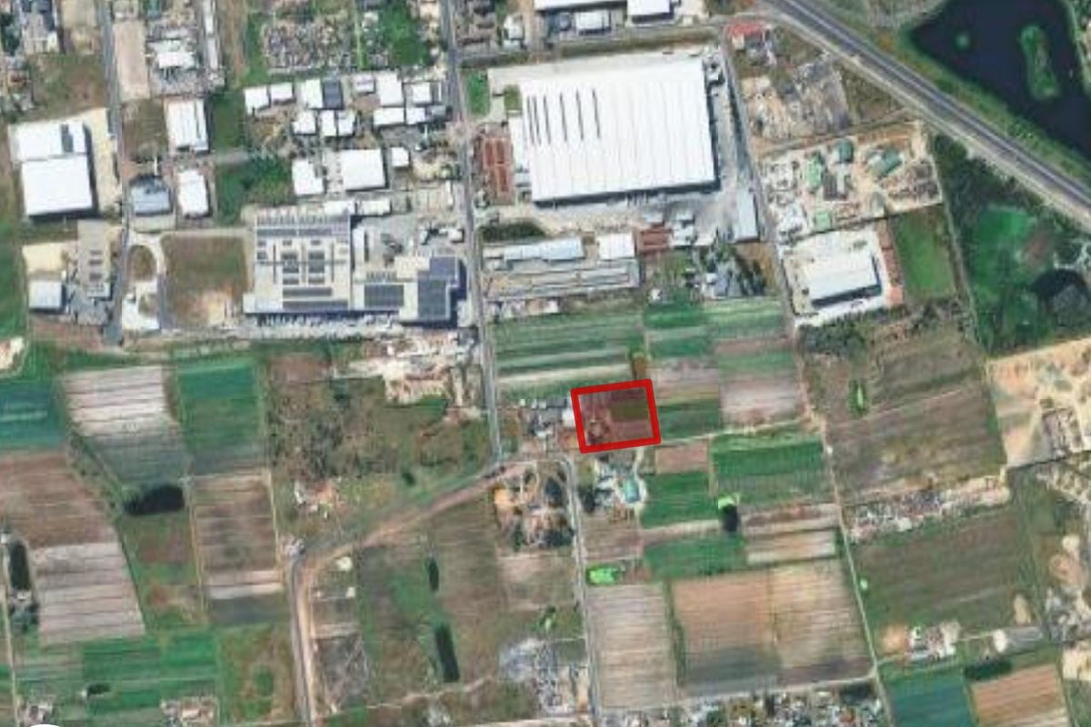An aerial view showing the property location within a surrounding agricultural and industrial landscape.
