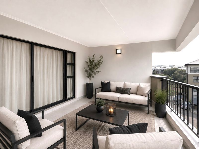 A well-maintained covered balcony featuring tiled flooring, a modern metal balustrade, and sliding glass door access to the interior living space.