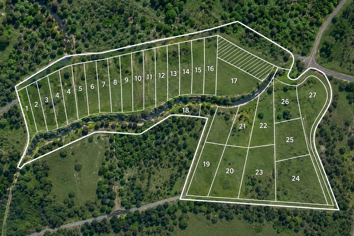 An aerial site plan showing the layout and numbering of multiple residential land parcels within the estate.