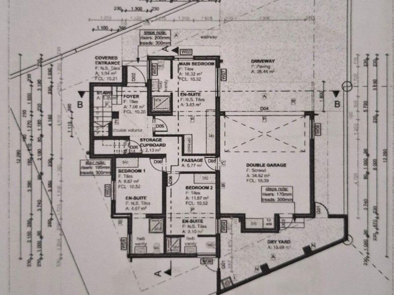 A detailed ground floor architectural plan showing the layout of bedrooms, bathrooms, double garage, and entrance areas.