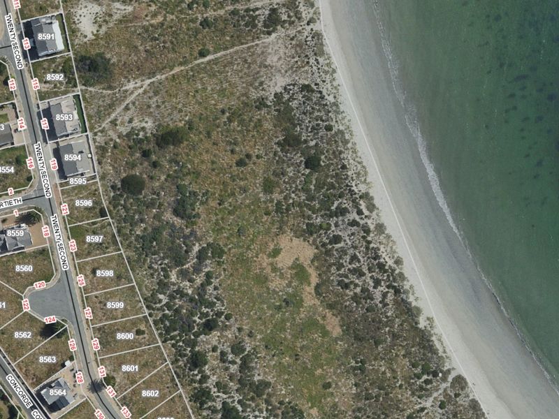 Aerial satellite view showing the property location and surrounding coastal landscape.