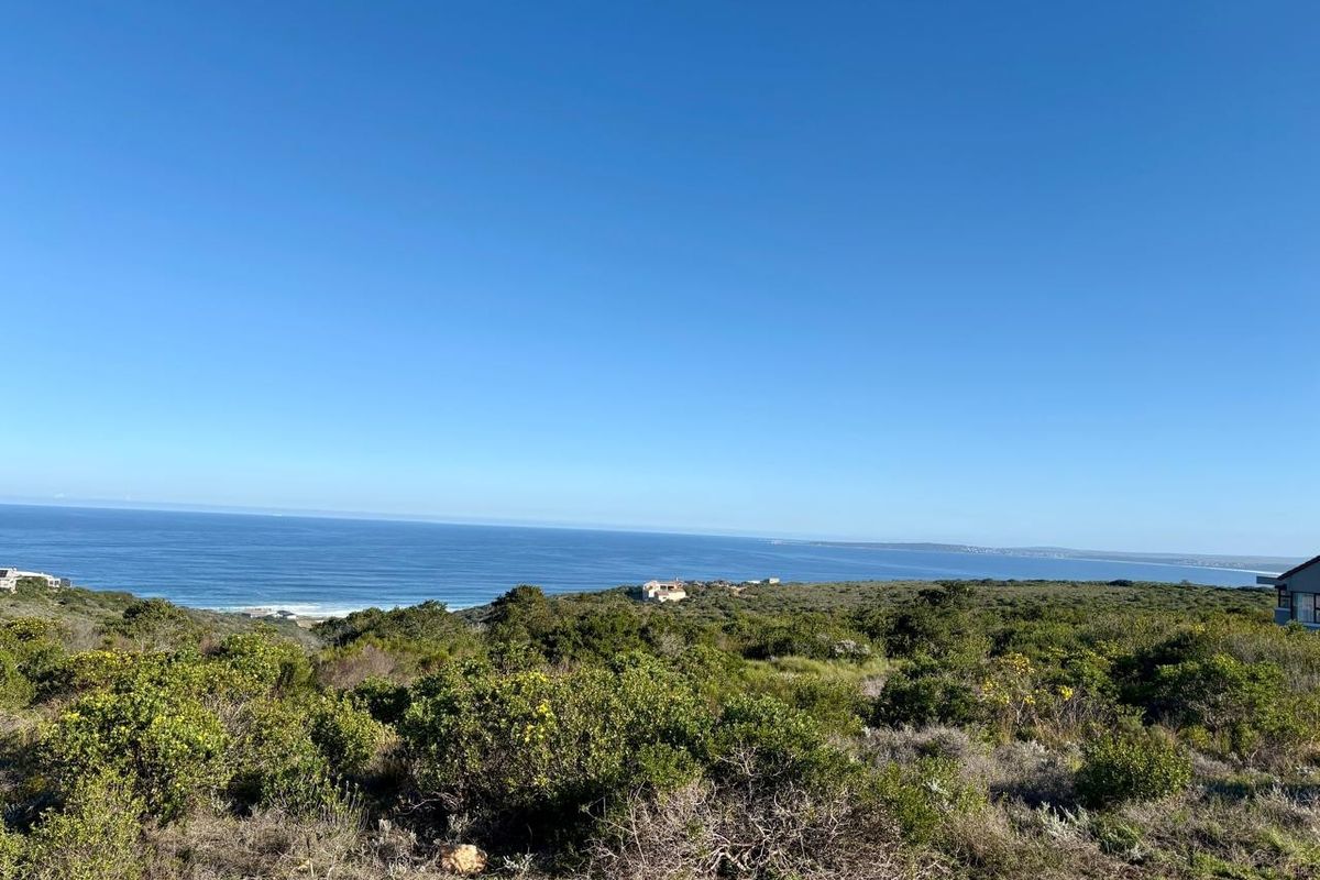 A scenic view of the coastline and ocean from the vacant residential land, showcasing the natural landscape and coastal horizon.