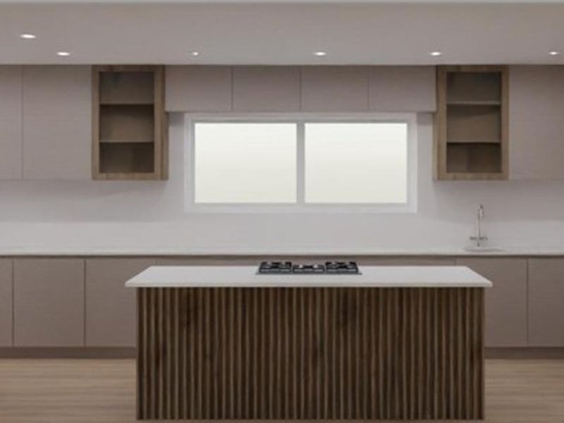 Modern kitchen featuring a central island with hob, integrated appliances, sleek cabinetry, and contemporary slatted wood detailing.